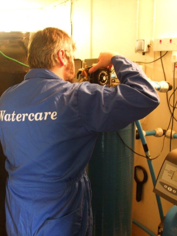 Watercare engineer servicing a water treatment system